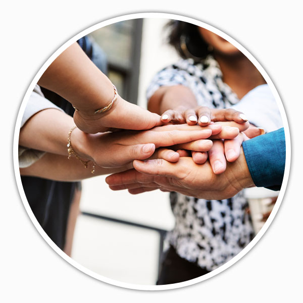 Team putting hands into circle